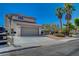 Front view of a two-story house with a gray door at 4773 Sarazen Cir, Las Vegas, NV 89103