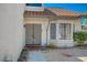 Front entry with gray double doors and a bay window at 4773 Sarazen Cir, Las Vegas, NV 89103