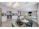 Open concept kitchen with breakfast bar and living room view at 4773 Sarazen Cir, Las Vegas, NV 89103