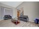 Living room features two sofas and a glass-top coffee table at 4773 Sarazen Cir, Las Vegas, NV 89103