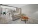 Living room with sofa and view of kitchen and dining area at 4773 Sarazen Cir, Las Vegas, NV 89103