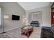 Spacious living room with bay window and wood-look floors at 4773 Sarazen Cir, Las Vegas, NV 89103