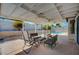 Relaxing covered patio with seating and pool view at 4773 Sarazen Cir, Las Vegas, NV 89103