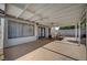 Covered patio with seating area, adjacent to the house and pool at 4773 Sarazen Cir, Las Vegas, NV 89103