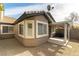 Charming backyard with gravel landscaping, and a covered patio area at 523 Painted Cloud Pl, Las Vegas, NV 89144