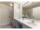 Well-lit bathroom featuring a double sink vanity, full mirror, and stylish decor at 523 Painted Cloud Pl, Las Vegas, NV 89144