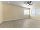 Bright bedroom with ceiling fan and ample natural light from two windows with blinds at 523 Painted Cloud Pl, Las Vegas, NV 89144