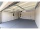 Garage features epoxy floors, storage solutions, and an insulated garage door, ready for your vehicles at 523 Painted Cloud Pl, Las Vegas, NV 89144