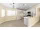 Modern kitchen featuring white cabinets, quartz countertops, and stainless steel appliances at 523 Painted Cloud Pl, Las Vegas, NV 89144