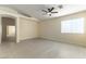 Open-concept living room with vaulted ceilings, ceiling fan, and light wood flooring at 523 Painted Cloud Pl, Las Vegas, NV 89144