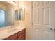 Clean bathroom with single sink vanity and mirror at 6412 Moss Agate Dr, Las Vegas, NV 89131