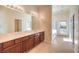 Bathroom boasts double sinks, a shower, and a tub at 6412 Moss Agate Dr, Las Vegas, NV 89131