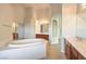 Luxurious bathroom with double vanity and tub at 6412 Moss Agate Dr, Las Vegas, NV 89131