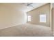 Bright bedroom featuring neutral walls and carpet at 6412 Moss Agate Dr, Las Vegas, NV 89131