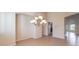 Bright dining room featuring a chandelier and adjacent kitchen access at 6412 Moss Agate Dr, Las Vegas, NV 89131