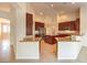 Open kitchen with granite counters and breakfast bar at 6412 Moss Agate Dr, Las Vegas, NV 89131