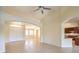 Open living room with high ceilings, tile floors and kitchen views at 6412 Moss Agate Dr, Las Vegas, NV 89131