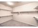 Spacious walk-in closet with ample shelving and hanging rods at 6412 Moss Agate Dr, Las Vegas, NV 89131