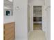 Bathroom vanity and walk-in closet with custom shelving at 8005 Egypt Meadows Ave, Las Vegas, NV 89178