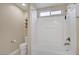 Bright bathroom featuring a tub/shower combo and a white toilet at 8005 Egypt Meadows Ave, Las Vegas, NV 89178