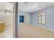 Bedroom view with bathroom access and mirrored closet at 8005 Egypt Meadows Ave, Las Vegas, NV 89178