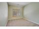 Empty bedroom with beige carpet and window shutters at 8005 Egypt Meadows Ave, Las Vegas, NV 89178