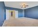 Spacious bedroom with double doors and ceiling fan at 8005 Egypt Meadows Ave, Las Vegas, NV 89178