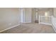 Carpeted hallway featuring doorways to adjacent rooms and views of the staircase at 8005 Egypt Meadows Ave, Las Vegas, NV 89178