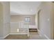 Hallway featuring carpet floors, an arched alcove and stairs to the lower floor at 8005 Egypt Meadows Ave, Las Vegas, NV 89178