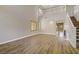 Spacious living room featuring high ceilings, wood floors, arched doorways, and natural light at 8005 Egypt Meadows Ave, Las Vegas, NV 89178