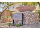 Stone community sign, showcasing lush landscaping, that provides a welcoming entry and aesthetic appeal to the area at 8005 Egypt Meadows Ave, Las Vegas, NV 89178