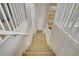 Carpeted staircase leading to the front door, with white railings and shutters in the background at 8005 Egypt Meadows Ave, Las Vegas, NV 89178
