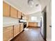 Kitchen with light wood cabinets, stainless steel appliances, and hardwood floors at 10199 Spider Rock Ave, Las Vegas, NV 89135