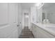 Clean bathroom with double vanity and gray floors at 10658 Salmon Leap St, Las Vegas, NV 89183