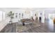 Elegant dining room with modern wood table and grey chairs at 10658 Salmon Leap St, Las Vegas, NV 89183