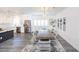 Open dining area with a large wooden table, connected to the kitchen at 10658 Salmon Leap St, Las Vegas, NV 89183