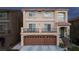 Two-story house with attached two-car garage and balcony at 10658 Salmon Leap St, Las Vegas, NV 89183
