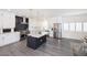 Modern kitchen featuring stainless steel appliances, white cabinets, and an island at 10658 Salmon Leap St, Las Vegas, NV 89183