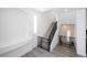 Modern staircase with metal railing and grey carpeting, adding a touch of elegance to the home at 10658 Salmon Leap St, Las Vegas, NV 89183
