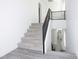 Modern staircase with metal railing leading to the upper floor at 10658 Salmon Leap St, Las Vegas, NV 89183