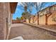 Backyard with gravel, a patio, and a block wall at 11740 Via Esperanza Ave, Las Vegas, NV 89138