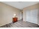 Bedroom with wood-look flooring, double door closet and wood dresser at 11740 Via Esperanza Ave, Las Vegas, NV 89138