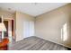 Bedroom with double door closet and wood-look flooring at 11740 Via Esperanza Ave, Las Vegas, NV 89138