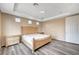 Bright bedroom with large window, wooden flooring and ample space at 11740 Via Esperanza Ave, Las Vegas, NV 89138