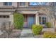 House entrance with light blue door and landscaping at 11740 Via Esperanza Ave, Las Vegas, NV 89138