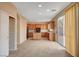 Kitchen with island, wood cabinets, and tile floors at 11740 Via Esperanza Ave, Las Vegas, NV 89138