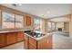 Open concept kitchen with views to living room and backyard at 11740 Via Esperanza Ave, Las Vegas, NV 89138