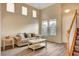 Living room with hardwood floors, neutral walls and a staircase at 11740 Via Esperanza Ave, Las Vegas, NV 89138