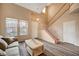Bright living room with hardwood floors, and a staircase at 11740 Via Esperanza Ave, Las Vegas, NV 89138