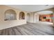 Open living room showcasing kitchen and staircase views at 11740 Via Esperanza Ave, Las Vegas, NV 89138
